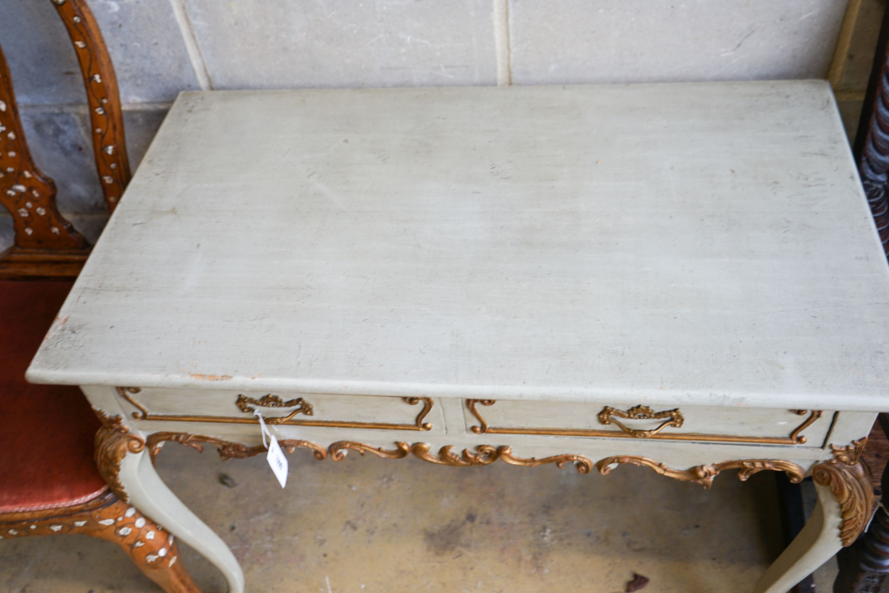 A late 19th century Italian painted and gilded two drawer side table, length 93cm, depth 53cm, height 73cm